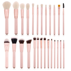 Detailed set of 24 pink and rose gold makeup brushes with soft bristles on white background