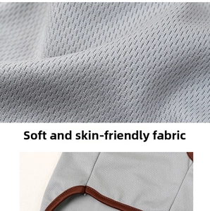 Close-up of soft breathable mesh fabric and brown trim on a grey summer pet vest