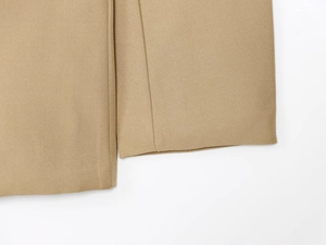 Detail shot of khaki twill fabric blazer hem showing clean double-line stitching