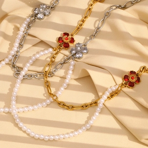 Double-layered stainless steel necklace with pearl and floral pendant on silk