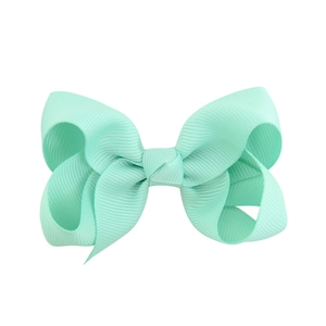 Mint green double-layered grosgrain ribbon hair bow clip on a clean white background