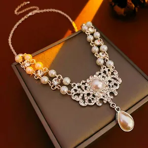 Luxury vintage pearl necklace with teardrop pendant and hollow diamond floral design