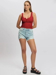 Detailed view of a red ribbed knit tank top with a button neckline and blue denim shorts