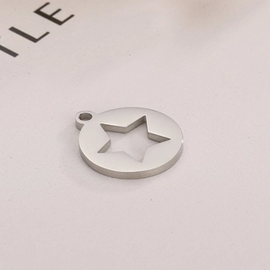 Detail shot of a silver stainless steel round pendant with a hollow star design