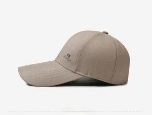 Detail view of khaki baseball cap featuring ripstop fabric texture and side embroidery