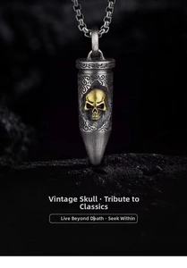 Macro detail of retro bullet pendant with golden skull carving and scrollwork patterns