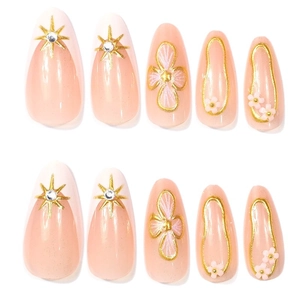 Pink French press-on nails with golden stars, floral 3D accents and rhinestones