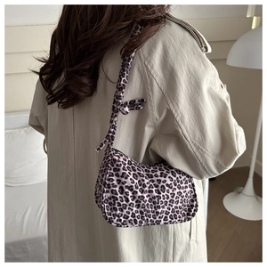 Fashionable leopard print shoulder bag with knotted strap and top zipper for women