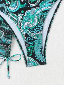 Detailed macro view of paisley print bikini bottom with stylish side tie strings
