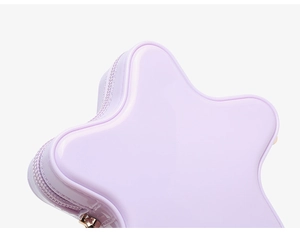 Close-up of glossy purple star-shaped PVC bag showing zipper detail and texture
