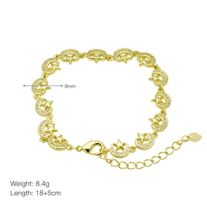 Detail view of 18k gold plated bracelet showing moon and star charms with white zircons