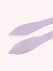 Detail view of light purple leather belts with fine stitching and smooth finish