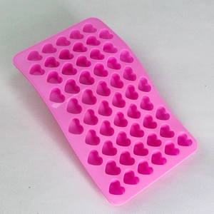 Detailed view of 55-cavity pink heart silicone mold for DIY chocolate and candy making