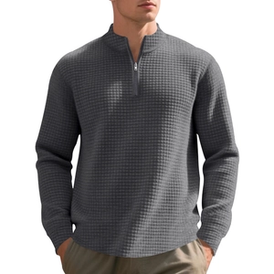 Close-up of the dark grey waffle textured fabric and half-zipper collar on this men sweater