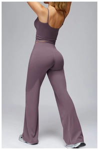 Detail of purple yoga set showing V-shaped high waist design and flared leg cut from behind