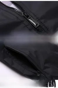 Detailed close-up of smooth zipper with pull cord and secure side pocket on black jacket
