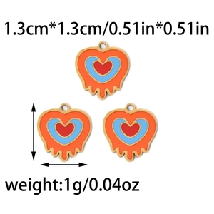 Macro detail of 304 stainless steel orange heart charms with melting enamel design effect