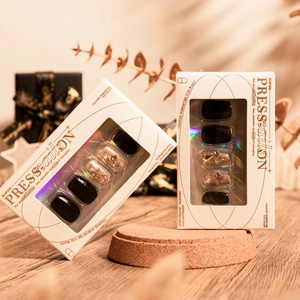 30pcs minimalist black press-on nails with champagne gold glitter and rhinestone accents