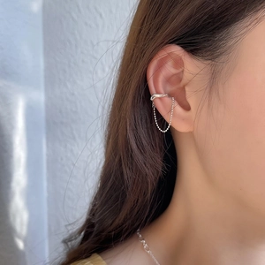 Close-up of S925 sterling silver irregular ear cuff with a delicate beaded chain drop