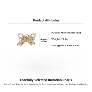 Detailed view of butterfly hair claw clip with golden alloy and faux pearls, size 4.5x5.5cm