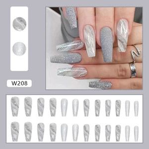 Detailed view of silver marble and glitter press on nails with elegant almond shape