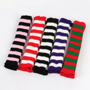 Five pairs of colorful striped knit arm warmers in various festive holiday patterns