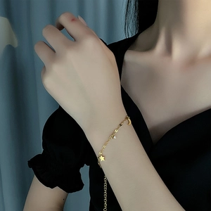 Elegant gold titanium steel bracelet with star, moon, and small diamond pendants for women