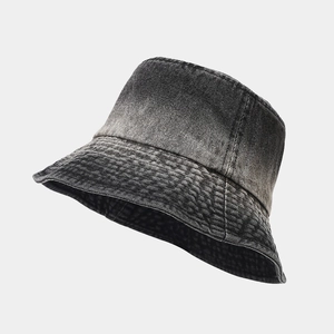 Close-up of vintage washed denim bucket hat showing detailed stitching and fabric texture