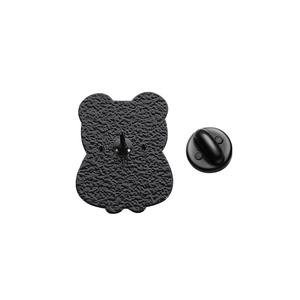Detail view of the black metal pin back with a secure rubber clutch on white background