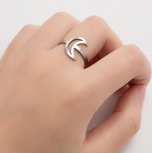 Minimalist silver stainless steel crescent moon ring worn on index finger for women