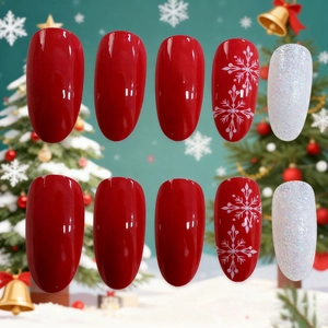 Christmas long almond press-on nails with red polish, snowflakes and silver glitter