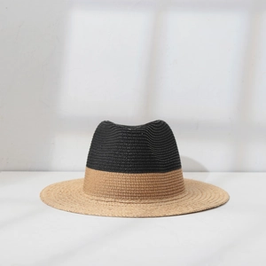 Close-up of dual-tone straw hat featuring black and beige raffia weave detail