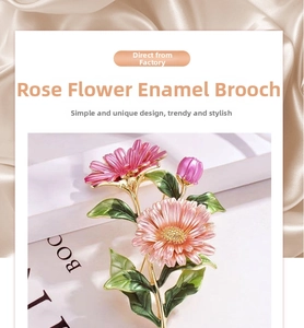 Close-up of elegant pink enamel rose brooch with green leaves on champagne silk background