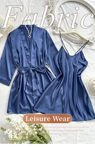 Detailed view of navy blue satin pajama set with robe and slip dress on elegant background
