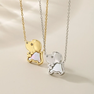 Detail of gold and silver elephant necklaces featuring shimmering shell and rhinestones