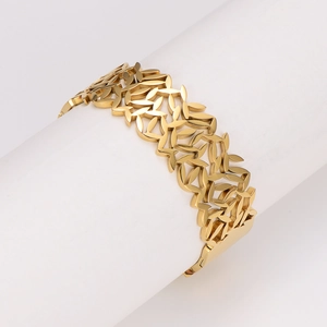 Minimalist gold leaf pattern stainless steel cuff bracelet on white background