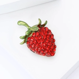 Exquisite red strawberry alloy brooch with rhinestones and green leaves on white base