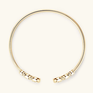 Bracciale rigido aperto minimalista in argento 925 con moissanite in finitura dorata