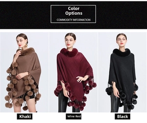 Knitted poncho with faux rabbit fur collar and pom-poms in khaki, wine red, and black