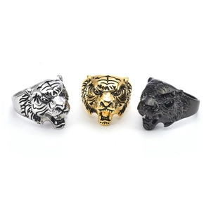 Three-color tiger head stainless steel rings in silver, gold, and black with relief detail