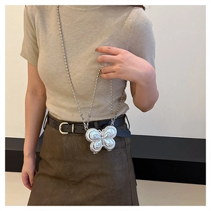 Close-up of a silver 3D butterfly-shaped crossbody box bag with metallic bead chain strap
