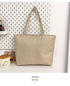 Detailed macro shot of high-density canvas texture and sturdy stitching on a beige tote bag