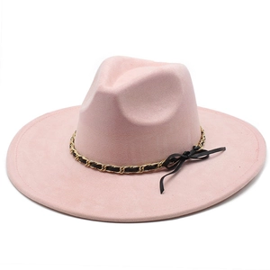Pink suede wide brim fedora with gold chain decorative band and black bow detail