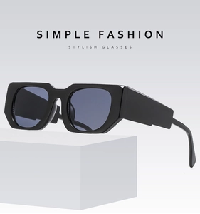 Chic black thick frame rectangular sunglasses on white geometric stand background