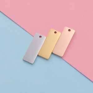 Detailed view of rectangular mirror stainless steel tags in silver gold and rose gold
