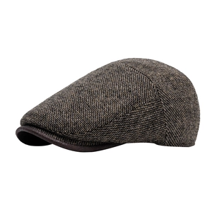 Classic herringbone tweed ivy cap in dark brown and gray with leather trim edge
