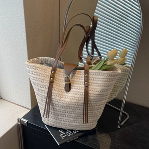 Handwoven straw tote bag with brown PU leather straps and front buckle for summer beach