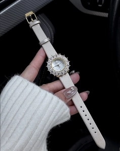Orologio elegante da donna con quadrante a girasole in strass e cinturino beige