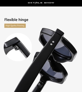 Detail of durable flexible hinge and silver metal studs on black glossy sunglasses frame