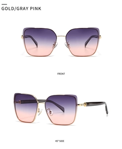 Detail view of large gold metal frame sunglasses with purple-pink gradient lenses